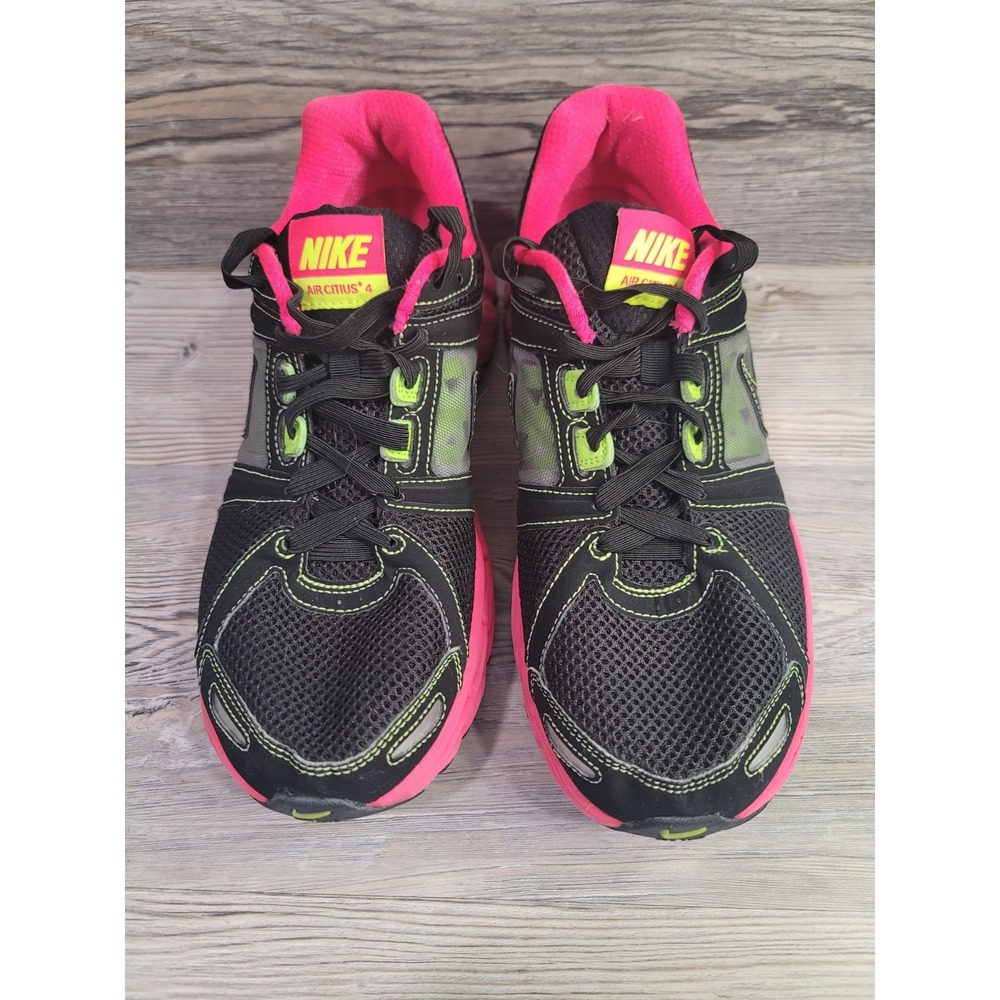 Nike woman's size 11 Nike air  running shoes. Black with pink high lights.